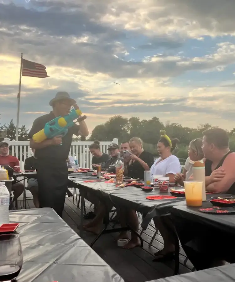 Private hibachi chef entertaining guests during an interactive hibachi at home experience in Connecticut