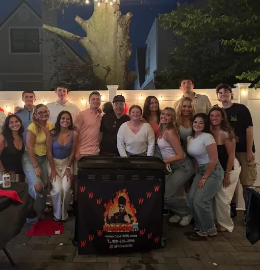 hibachi at home airbnb delaware – night group photo after dinner with chef