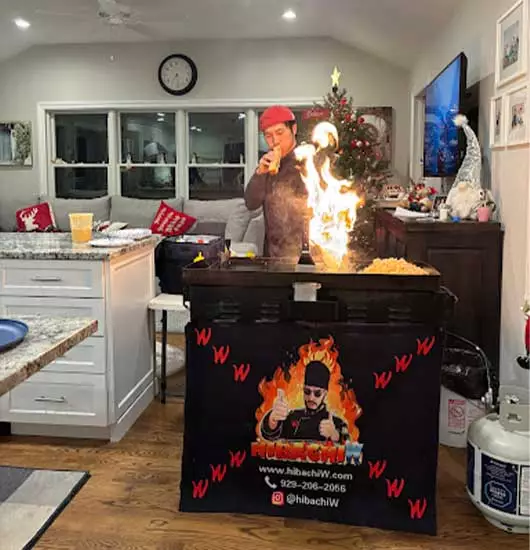 Private hibachi chef sake show with guests at home at a private vacation rental in Florida