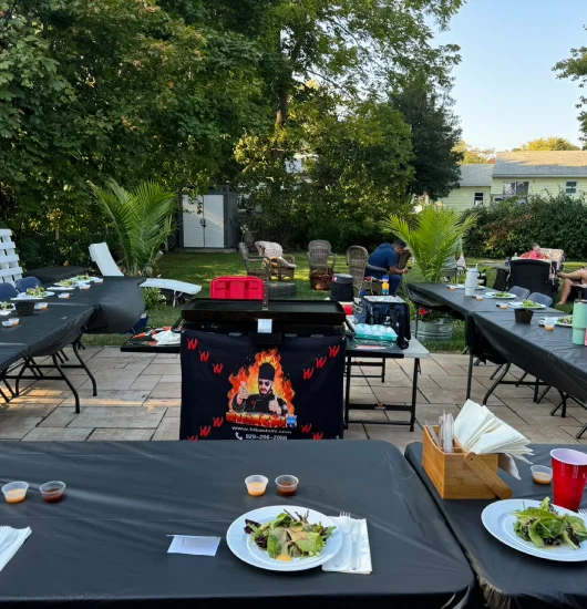 Private hibachi chef preparing dinner — backyard family setup or rental home in New Jersey
