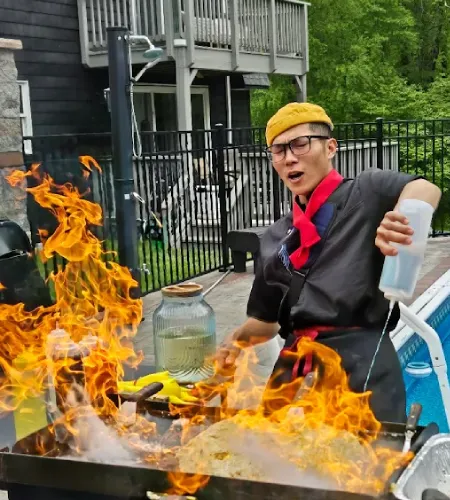 Live fire show by a hibachi chef during an at-home hibachi experience in North New Jersey  