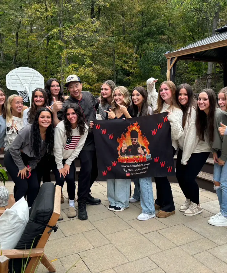 Group enjoying a relaxed hibachi at home night in a backyard in Pennsylvania