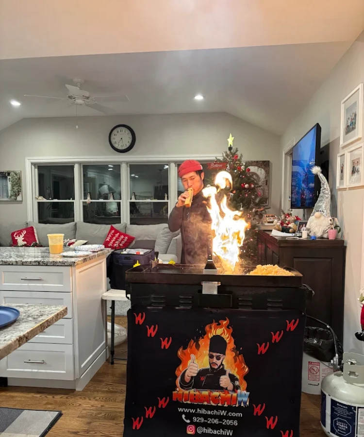 Hibachi at home in Wilmington – chef performing a brief fire show during indoor service