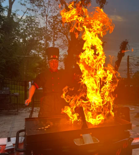 Hibachi chef performing a live fire show during private teppanyaki dinner