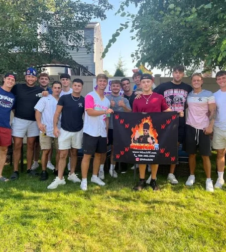 Group of friends celebrating a backyard hibachi party with private chef and Hibachi W banner